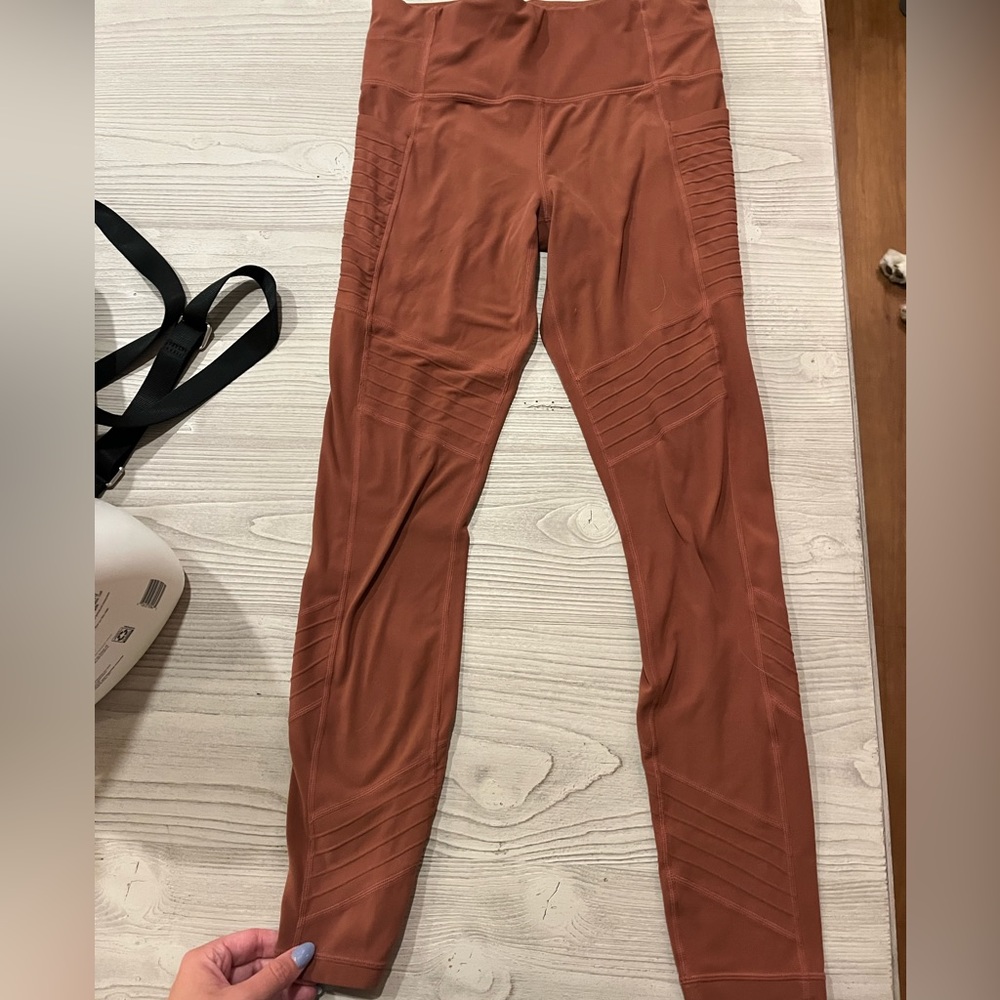 Athleta Moto style leggings in a orange brown color